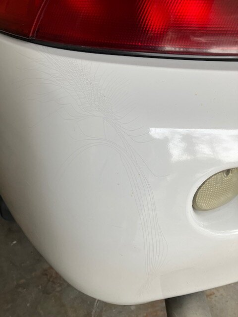 Rear bumper paint crack.JPG