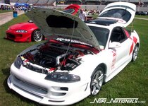 eclipse%20white%20with%20red%20mitsubishi%20symbol%20in%20back.jpg