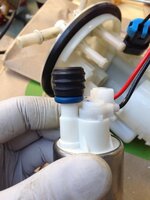 Evo fuel pump grommet, Post #1 in the EvoM Walbro 450 thread, he replaces the stock white spac...jpg