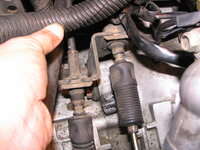 tranny shift cables in mounting bracket on tranny.JPG